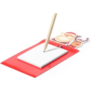 A red magnetic notepad featuring a Santa and reindeer design, with a wooden pencil on top.