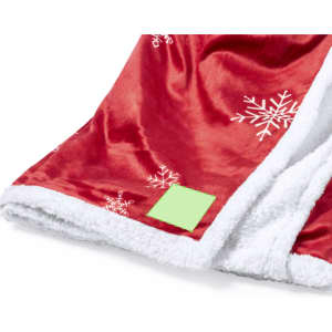 A red blanket with white snowflake patterns and a fluffy white interior. Features a green tag.