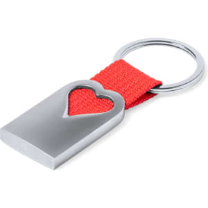 A silver keyring with a heart-shaped cutout, featuring a red fabric strap.