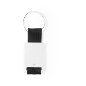 A keyring featuring a silver metal ring and a black woven strap, with a white rectangular decorative element.