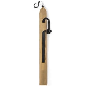 A brown Caterpil Walking Pole with a black strap and hook, featuring a protective cover.