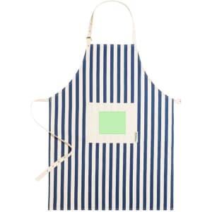 A striped apron in navy blue and white with a light green pocket and a logo.