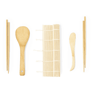 A bamboo sushi making set including chopsticks, a spatula, a rolling mat, and a shaping tool.