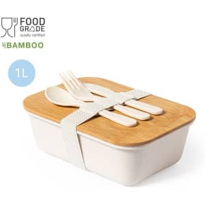 A food container with a bamboo lid, featuring a white body, and utensils secured by a strap.