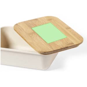 A bamboo lid partially covering a cream-coloured container with a green label area. The container has a rectangular shape.