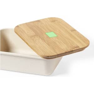 A rectangular container with a natural bamboo lid, featuring a light green accent on top.