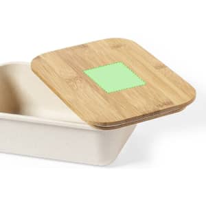 A rectangular container with a bamboo lid, featuring a green square patch on top. The container is a light colour.