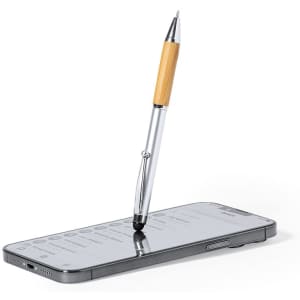 A silver stylus touch ball pen with a wooden grip balanced on a smartphone screen. The pen has a branding logo.