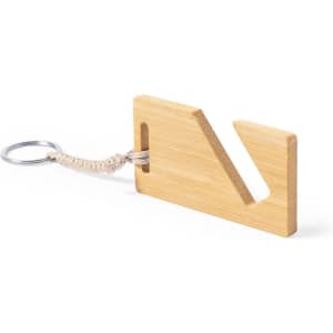 A bamboo keyring with a unique cut-out shape and a woven cord attached to a metal ring.