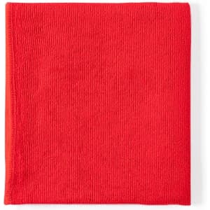 A red towel made from soft material, featuring a textured surface and a logo in one corner.