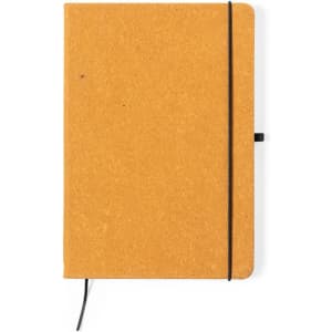 A mustard-yellow notepad with a black elastic band and a black bookmark, featuring a minimalist design.