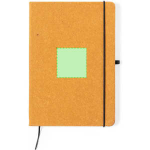 A brown notepad with a black elastic band and a square green patch on the cover, featuring a logo.