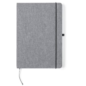 A grey notepad with a textured cover, featuring an elastic band and a bookmark. It has a logo on the front.
