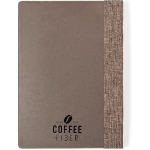 A brown notepad with a textured beige cover and a logo, made from coffee fibre materials.