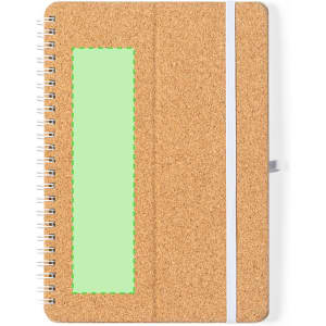 A cork-covered notebook with a white elastic closure and a green rectangular section. It features a branded logo.