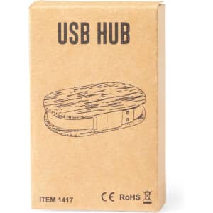 A USB hub in an oval shape, packaged in a brown cardboard box featuring a simple design and logo.