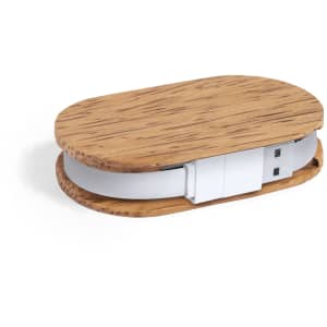 A USB hub with a wooden finish, featuring a sleek oval shape and a white USB connector.