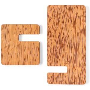 Two wooden wireless chargers in a warm, natural finish with unique grain patterns. One is larger, and the other is smaller.