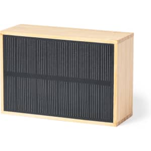 A rectangular speaker in natural wood finish with a textured black front panel. It features a logo on one side.