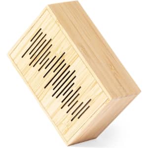 A wooden speaker with a stylish bamboo finish, featuring a slotted design for sound enhancement and a logo.