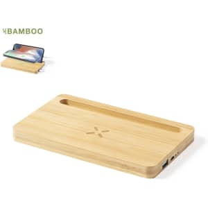 A bamboo wireless charger with a slot for a phone and a branding logo on the surface.