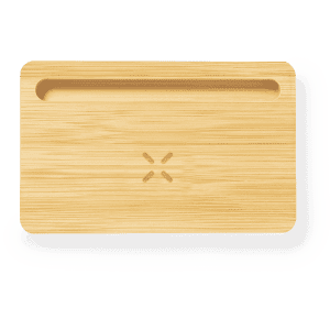 A bamboo organiser charger with a sleek design and a small groove for easy device placement.