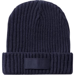 A navy blue ribbed beanie hat with a folded cuff and a logo patch on the front.