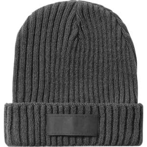 A grey beanie hat with a ribbed texture and a small logo patch on the band.