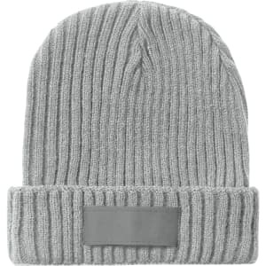 A grey beanie with a ribbed texture and a small patch for branding.