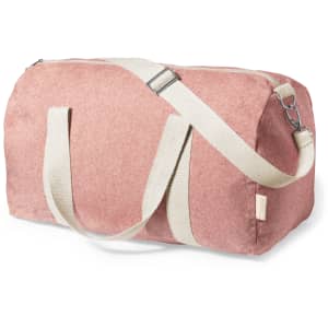 A pink duffel bag with a cream strap and handles, featuring a logo. The bag has a zippered closure.