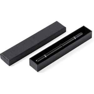 A black metal pen nested inside an open black box, featuring a simple and elegant design.