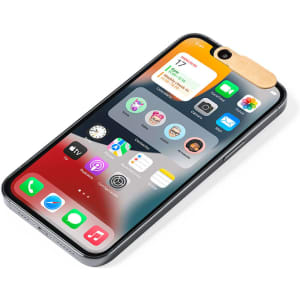 A phone displaying the home screen with a wooden webcam cover attached at the top. The phone has a sleek design.