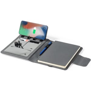 A grey multifunction notepad with a pen, charging cables, and a slot for a phone. It features a logo.