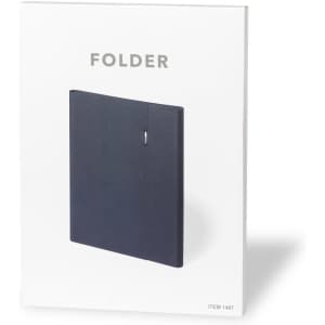 A navy folder with a simple design and branding on the front, packaged in a white cover.