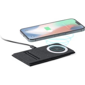 A wireless charger in black, with a smartphone above displaying a charging indicator. It has a sleek, modern design.