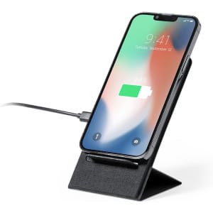 A wireless charger in black with a phone displaying a charging indicator, positioned on a stand.