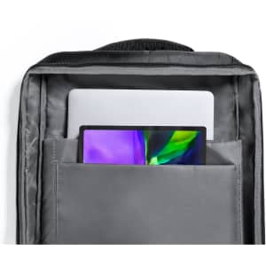 A grey document bag backpack with a tablet and laptop visible inside. Features a simple design and has a logo.