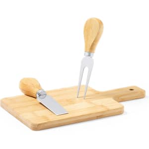 A cheese knife set with stainless steel blades and wooden handles on a bamboo cutting board.