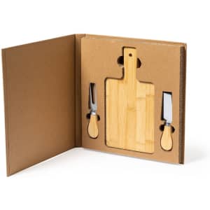 A bamboo cheese board with two stainless steel cheese knives in a cardboard presentation box.