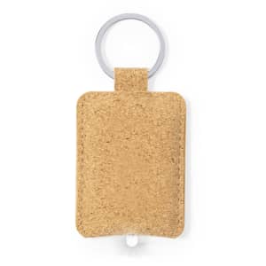 A keyring featuring a textured cork body with a silver ring. Simple and functional design.