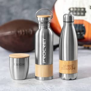 A drink bottle trio featuring stainless steel and wooden accents, including a sleek bottle with a handle, a classic design, and a cup.