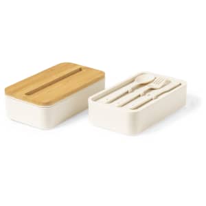 A beige lunch box with a bamboo lid, featuring compartments for cutlery inside.
