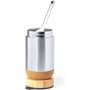 A stainless steel container with a cork base, featuring a spoon resting on the lid.