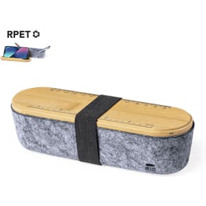 A grey pencil case with a wooden lid featuring a ruler, secured with a black strap. It has a logo.