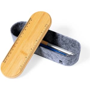 A bamboo and felt pencil case with a ruler design on the lid, containing a pen and a pencil.