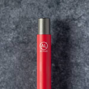 A red metal pen with a silver tip and a branding logo, designed from recycled materials.