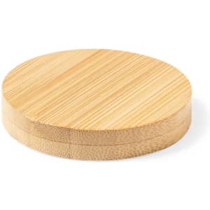 A round bamboo coaster with a smooth surface, showcasing natural wood grain patterns and a circular shape.