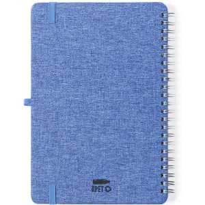 A blue spiral-bound notebook with a textured cover and a logo at the bottom. It features an elastic band closure.