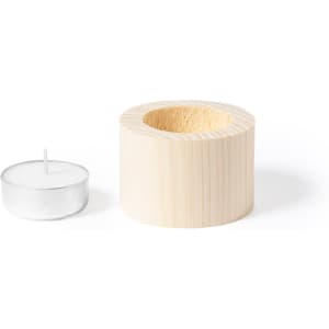 A wooden candle holder with a circular design and a tea light candle beside it.