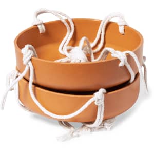 A set of two terracotta bird feeders with white rope handles, designed for outdoor use.